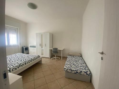 Postel nebo postele na pokoji v ubytování Forlanini 44