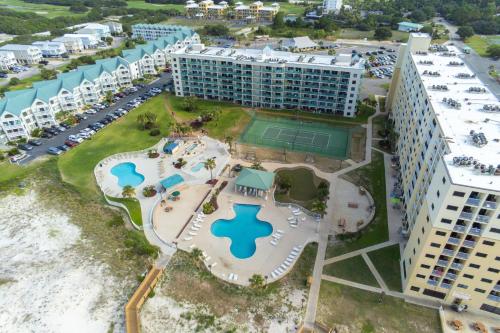 an aerial view of a resort with a tennis court at Plantation West 1267 in Gulf Highlands