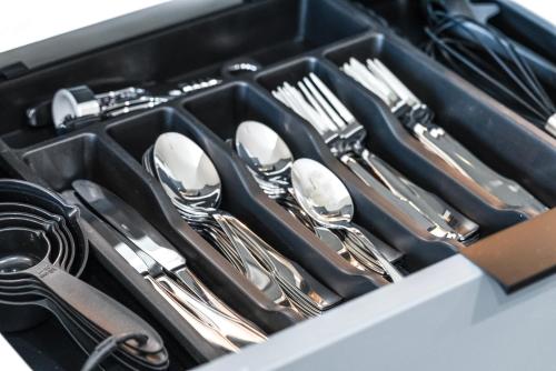 a tray of silver utensils in a drawer at The Rambler Inn in Arlington