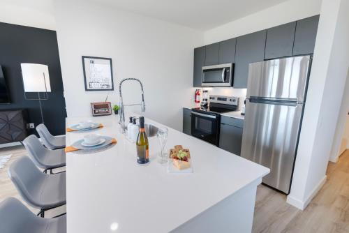 a kitchen with a white counter and a refrigerator at The Rambler Inn in Arlington