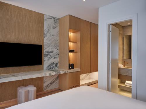 Postel nebo postele na pokoji v ubytování Nur City Suites