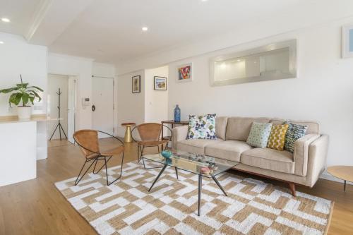 a living room with a couch and a table at LV Premier Amoreiras AM3 in Lisbon