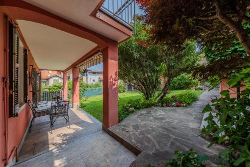 a porch of a house with a bench on it at Villa Nonni in Acquaseria