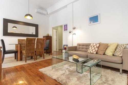 a living room with a couch and a table at LV Premier Apartments Baixa- CR in Lisbon