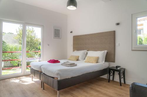 Katil atau katil-katil dalam bilik di LV Premier LA2 pool, AC, garden, sea view