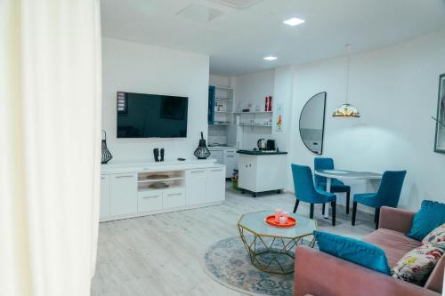 a living room with a couch and a table at Apartman Suada in Fojnica