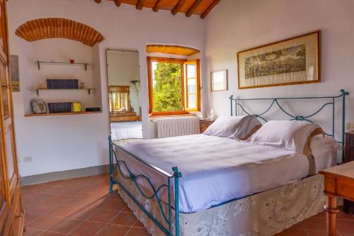 Ένα ή περισσότερα κρεβάτια σε δωμάτιο στο Agriturismo Panzanello