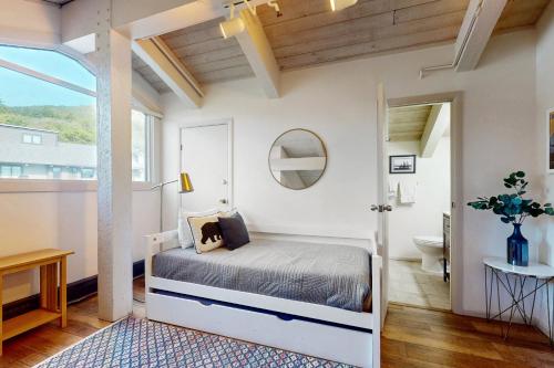 a bedroom with a bed and a bathroom at Snowmas Village A4 in Snowmass Village