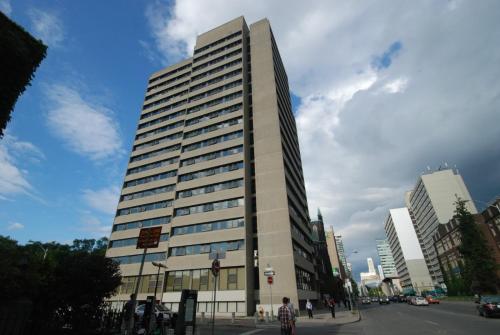 a tall building on the side of a city street at Tartu College Student Residence in Toronto