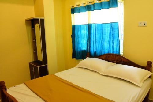 Shree Varahi Residencyにあるベッド
