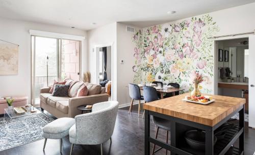 a living room with a couch and a table at TC Sweet Pea - 2-Bedroom Condo Near Downtown TC! in Traverse City