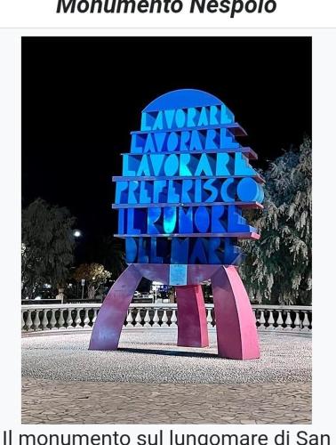 a sculpture of a tree in the middle of a street at Casa Patrizia in Acquaviva Picena