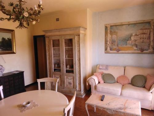 a living room with a couch and a table at Casa Patrizia in Acquaviva Picena