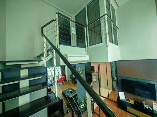 a staircase in a house with a living room at Maritime Suite by Ocean Luxe 2BR Seaview Dryer Water Dispenser in George Town