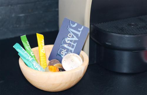 a wooden bowl filled with different types of snacks at Chez Clém - 3 chambres - garage privé - wifi - Netflix in Reims