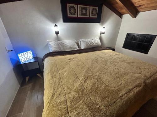 Postel nebo postele na pokoji v ubytování Cabañas La Victoria By GEstores
