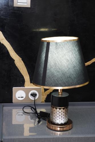 a lamp sitting on top of a table at Appartement de très haut Standing à la Marina de Saïdia Résidence TAMARIS 6 piscine VIP in Saidia 
