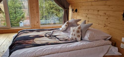 Postel nebo postele na pokoji v ubytování Resort Rykowisko DeLuxe No 3