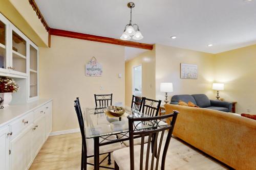 a living room with a table and chairs and a couch at Hungry Horse Hideout - Lower Level in Hungry Horse
