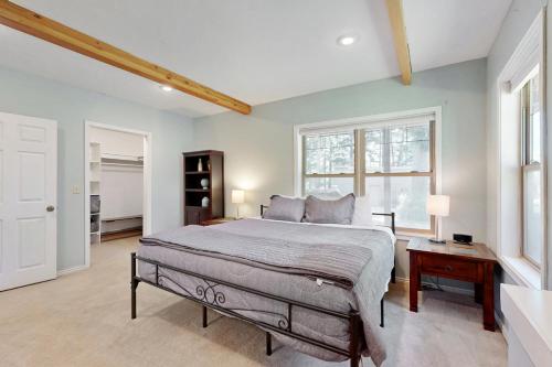 a bedroom with a large bed and a window at Hungry Horse Hideout - Lower Level in Hungry Horse