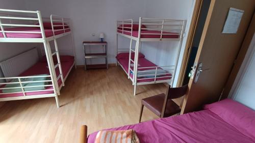 Katil atau katil-katil dalam bilik di Albergue El Caserón de Vidiago