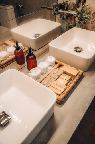 a bathroom with two sinks and towels on a counter at Mawella Beach Resort in Tangalle