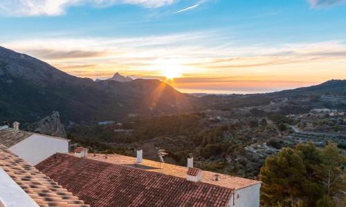 a view of the sunset from the roof of a house at El Balcón Guadalest in El Castell de Guadalest