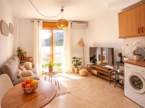 a living room with a bowl of fruit on a table at El Balcón Guadalest in El Castell de Guadalest