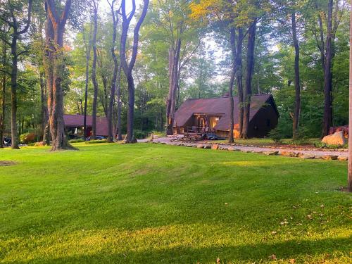 a house in the middle of a green field at Claycomb Chalets in Champion