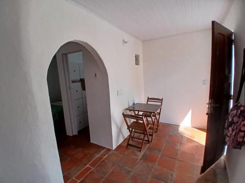 a dining room with a table and chairs in a room at Pousada Unidos in Jijoca de Jericoacoara