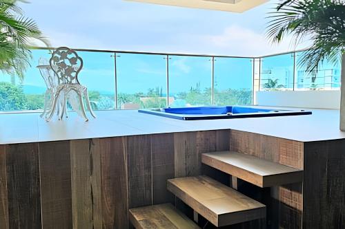 a bar with a pool table and a chair at Hotel Lotto Boutique in Cali