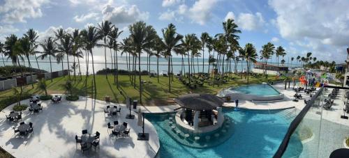 an aerial view of a swimming pool at a resort at Porto Alto Resort ap 213 in Cupe