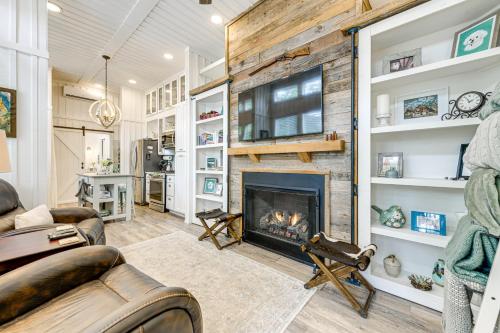 a living room with a fireplace and a couch at Highlands Vacation Rental - Walk to Main St! in Highlands