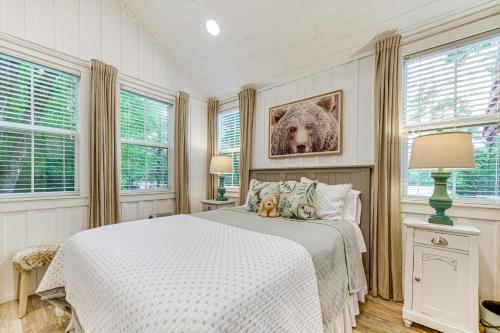 a bedroom with a bed with two stuffed animals on it at Highlands Vacation Rental - Walk to Main St! in Highlands