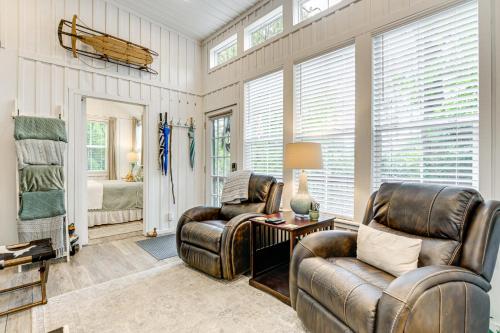 a living room with two chairs and a table at Highlands Vacation Rental - Walk to Main St! in Highlands