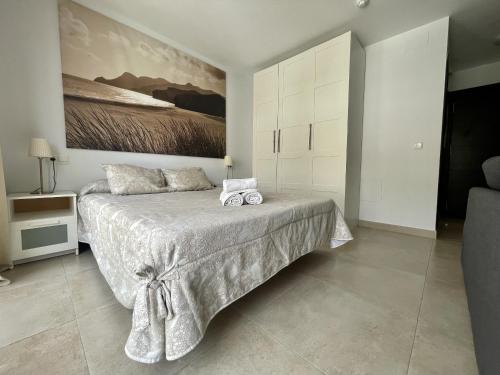 Katil atau katil-katil dalam bilik di Apartamentos & SPA Torres de San Juan