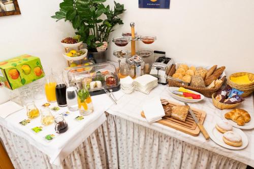 a table with a buffet of breakfast foods on it at Erlebnishaus Spiess in Feldkirchen in Kärnten