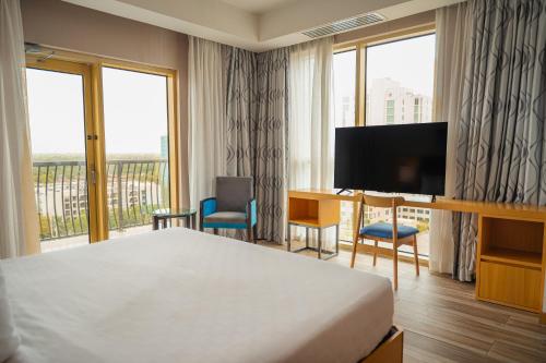 Телевизор и/или развлекательный центр в Galaxy Hotel Downtown