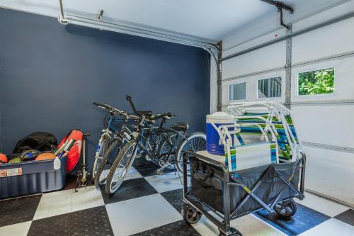 two bikes parked in a garage with a cart at Hearth & Timber in Bridgman