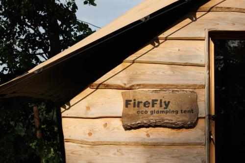 a sign on the side of a building at Lakeside Glamping Tents Mažijev Grič in Gradišče pri Lukovici