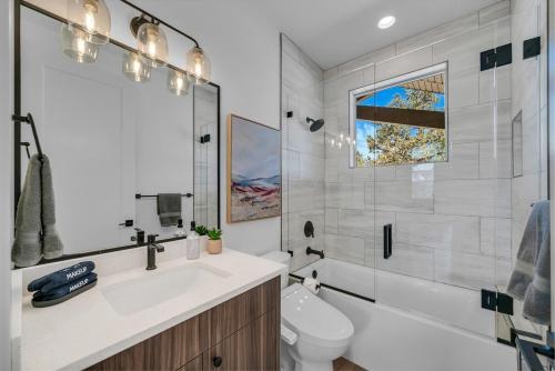 a bathroom with a tub and a sink and a toilet at Desert Canyon Casita Near Zion Hot Tub Views in Orderville