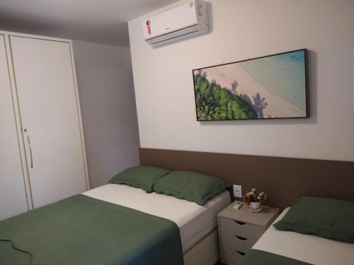 Ένα ή περισσότερα κρεβάτια σε δωμάτιο στο Praia do Forte Sensacional