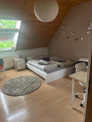 a bedroom with a bed in a attic at Zentral im Grünen in Dortmund