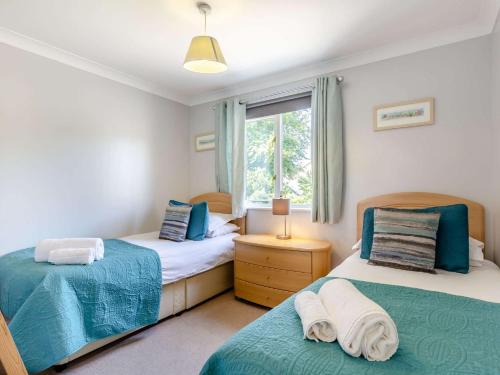 En eller flere senge i et værelse på 3 Bed in Goldenbank 89103