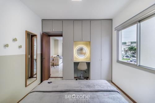 Giường trong phòng chung tại Aptos completos a poucos minutos da Praia de Jurerê - CIE