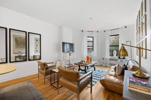 a living room with a couch and a table at Harlem Renaissance in New York