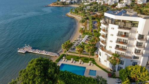 an aerial view of a building next to a beach at Med-Inn Hotel in Gulluk