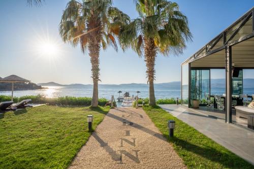 a house with a sign that reads karma at Med-Inn Hotel in Gulluk