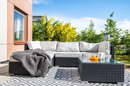 a living room with a couch and a coffee table at Appartment close to Hyllie in Klagshamn
