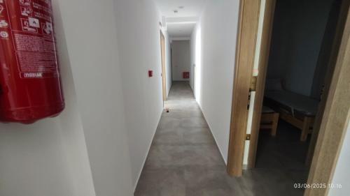 a hallway leading to a room with a hallway at ΣΤΕΡΓΙΟΥ ΠΑΝΑΓΙΩΤΗΣ studio in Loutra Edipsou